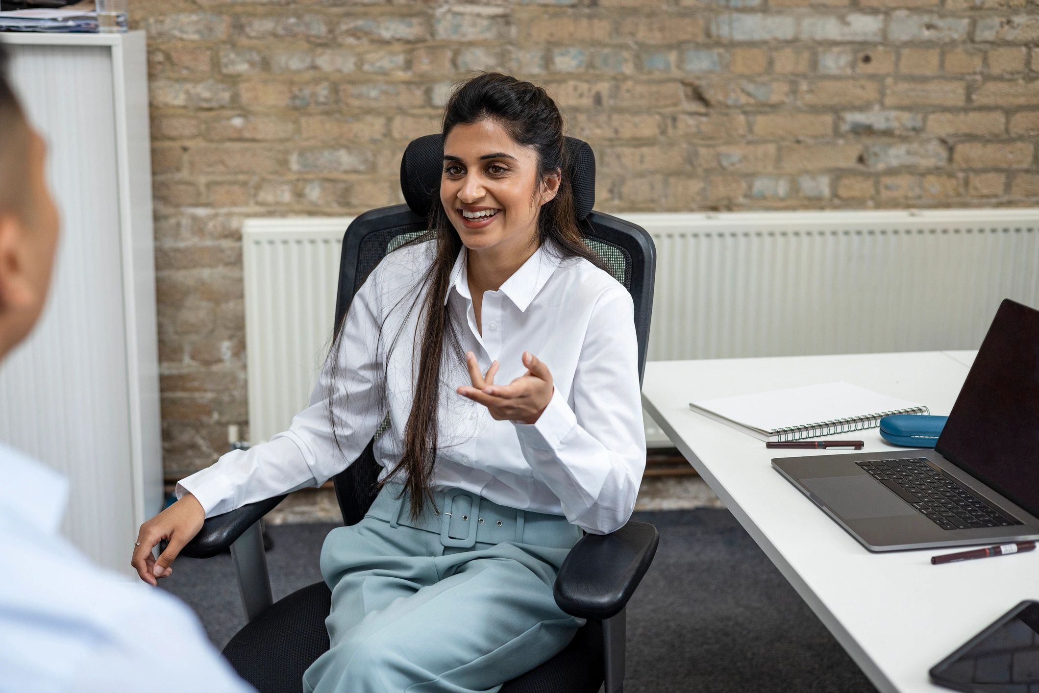 Executive coaching conversation in a modern office